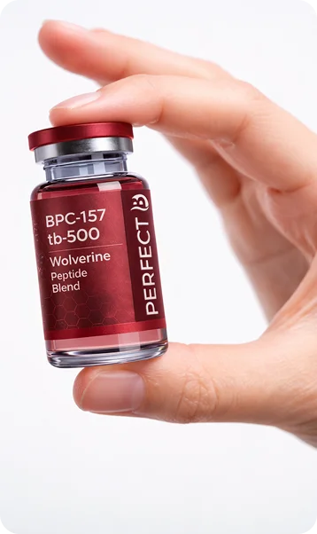 Perfect B - Blog - Wolverine Peptide BPC-157 TB-500 - Hand holding BPC-157 and TB-500 peptide vials at Perfect B clinic
